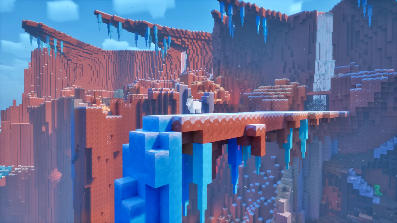 Snowy red-rock Minecraft Dungeons II canyon with a goat beside an icy waterfall