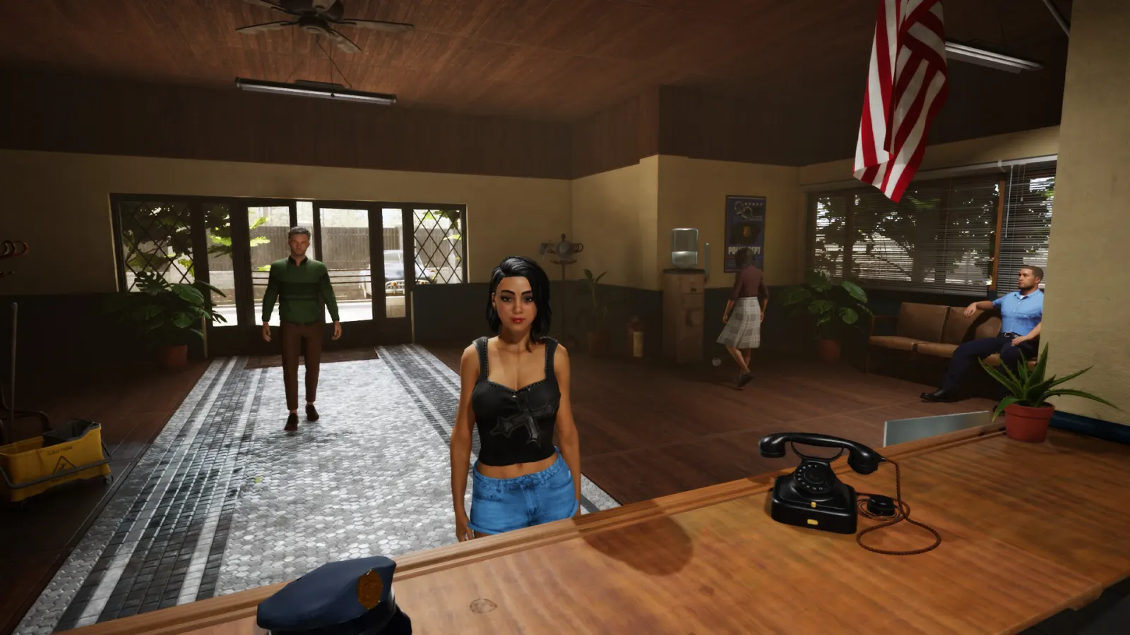 A civilian waits at the police station reception desk beside a rotary phone